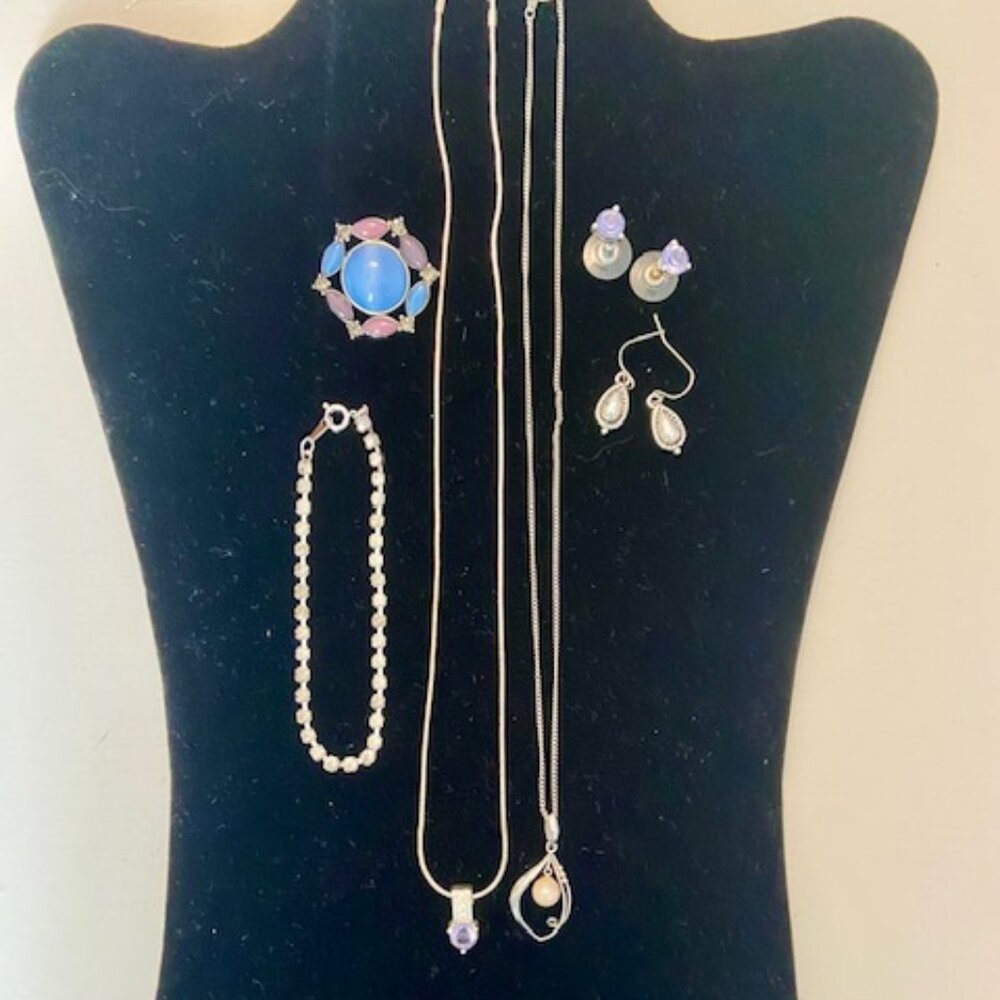 Costume jewelry lot in blue, purple, silver  one marked NAPIER